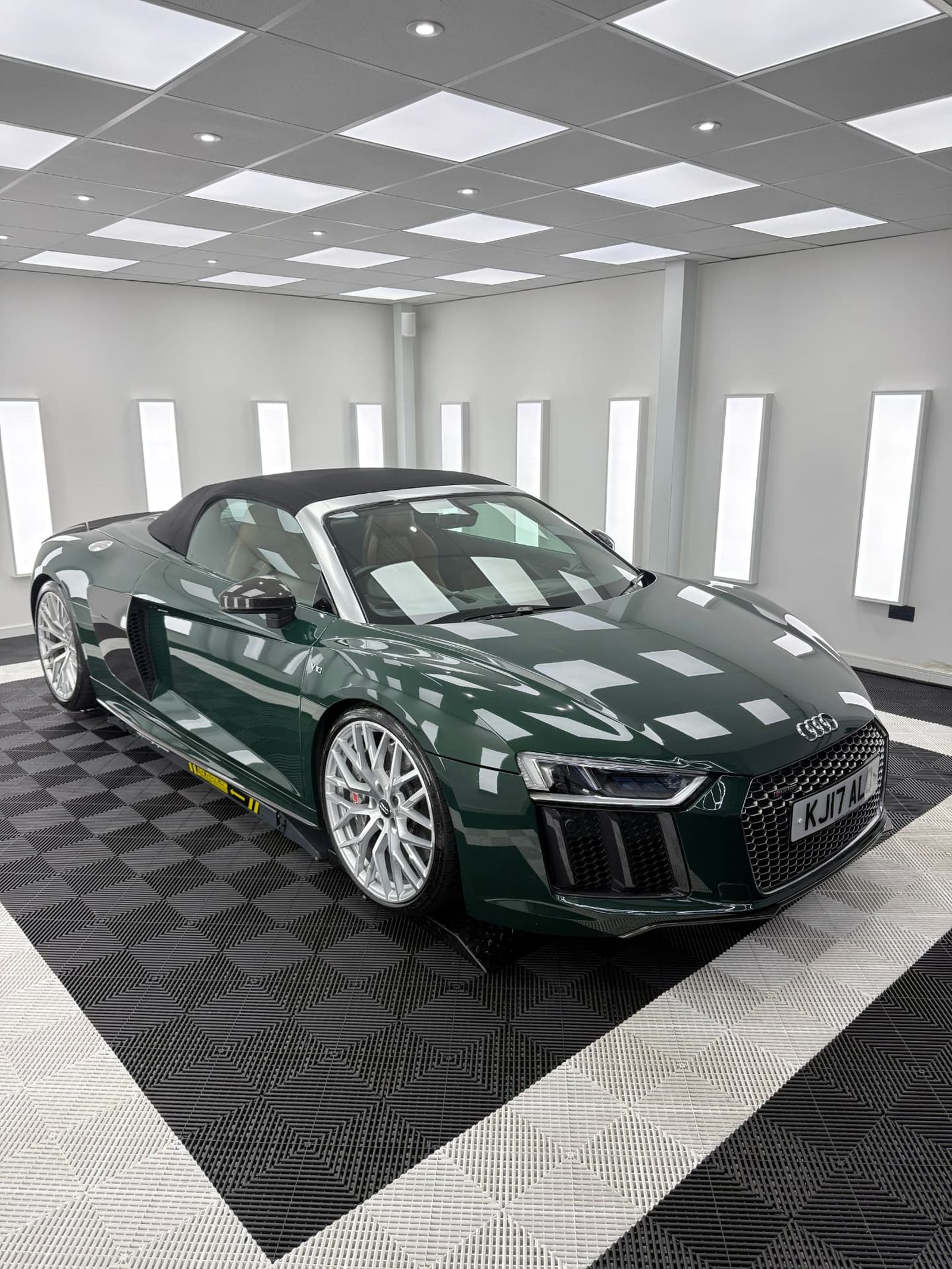 Green Audi R8 Spyder convertible front three quarter view in the Elevate Detailing UK studio in Exeter